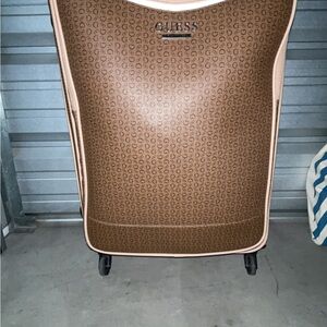 Guess brown monogram rolling suitcase with beige trim